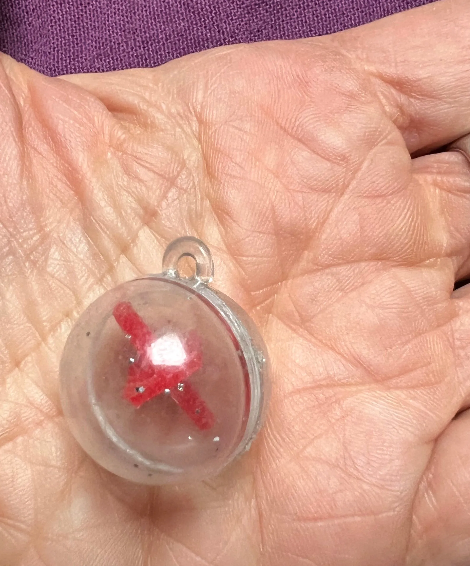 A Strange Ball Charm with Spinning Top Inside